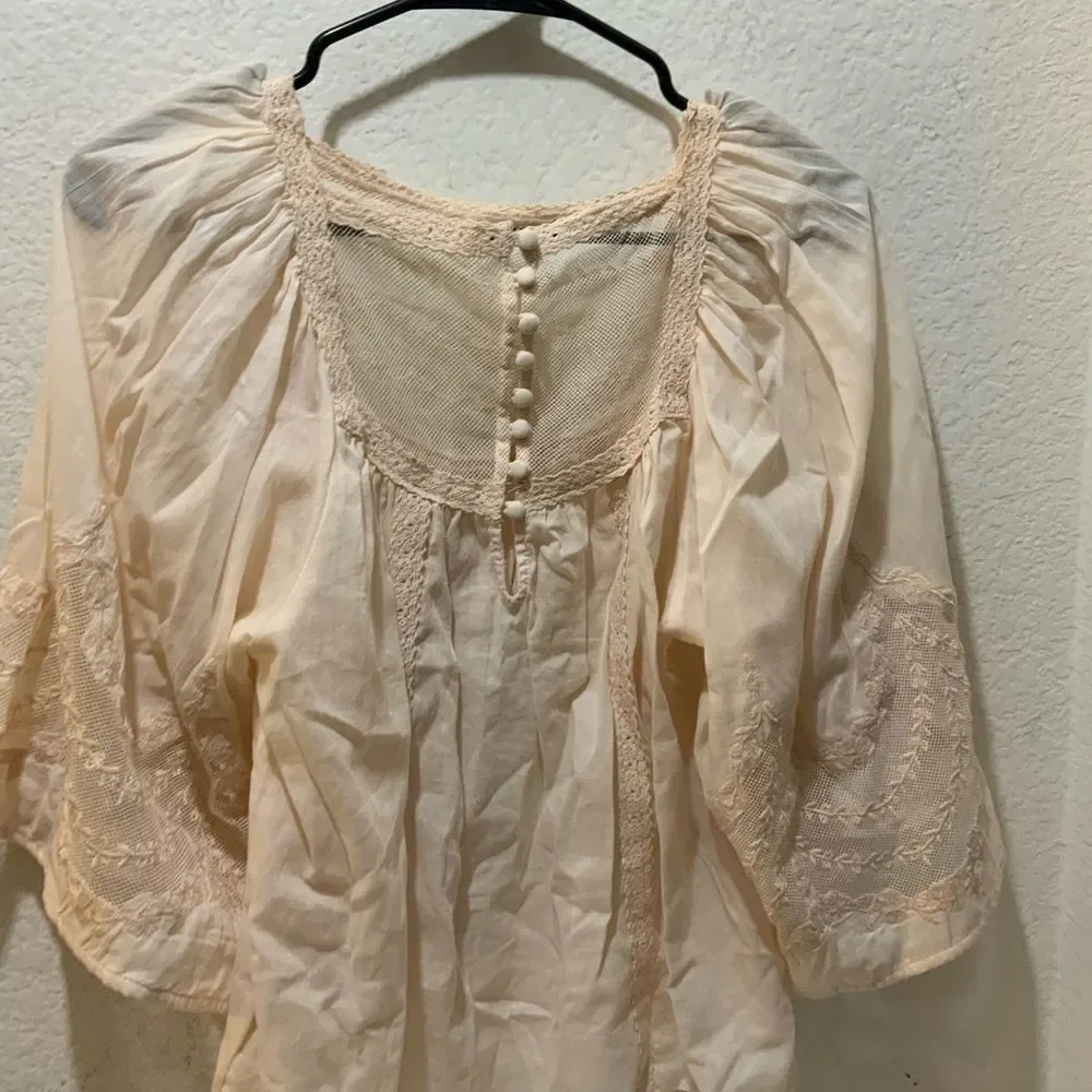 Anthropologie eyelet bell sleeve peasant top